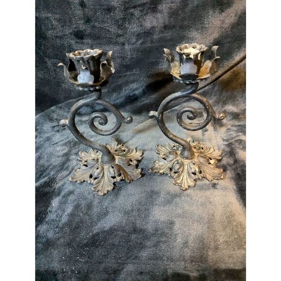 Vintage ornate Cast iron candle holders. In good condition.